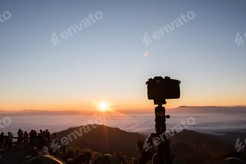 Preview: Dslr digital professional camera stand on tripod photography on the mountain