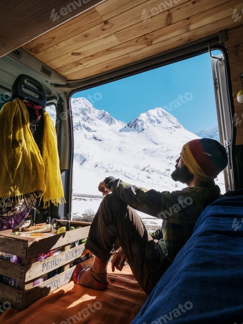 Preview: Man looking at mountains