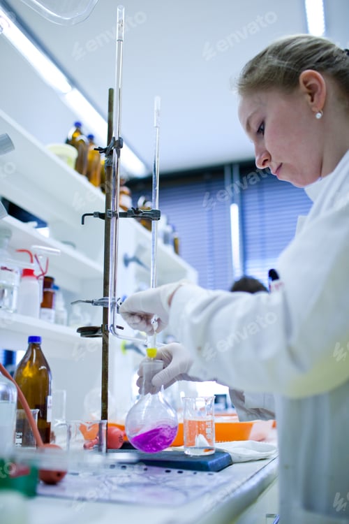 Preview: portrait of a female researcher carrying out research in a chemi