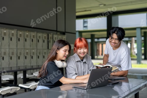 Preview: Three young people are sitting at a table in a school cafeteria