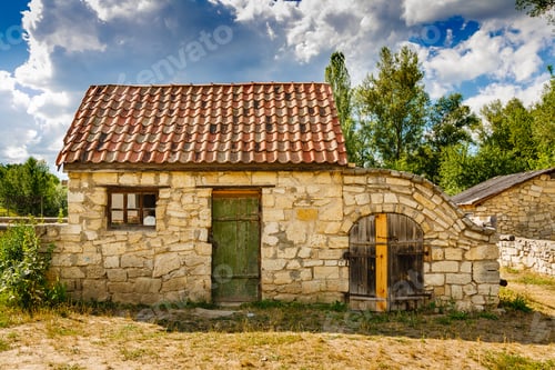 Preview: Ancient stone house with a roof of tile