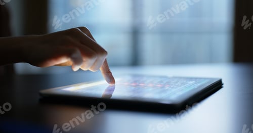 Preview: Woman touch on the screen of tablet computer