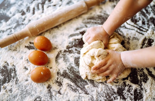 Preview: Small hands kneading dough. Little child preparing dough for backing. Kid's hands, some flour.