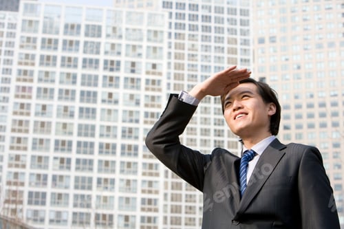 Preview: Businessman looking off in the distance