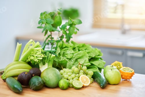 Preview: Fresh green fruit and vegetables on wooden counter