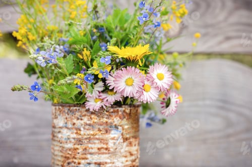 Preview: a bouquet of wildflowers of forget-me-nots, daisies and dandelions in full bloom. cottagecore scene