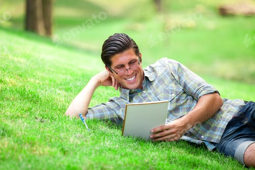 Preview: Young student with note at outdoor