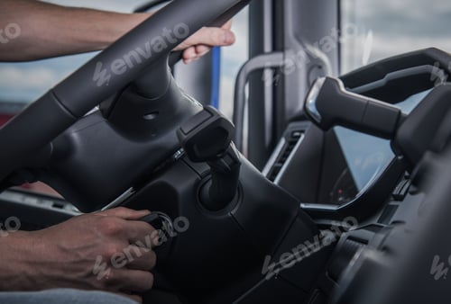 Preview: Hands Starting a Truck's Ignition in Dark Interior