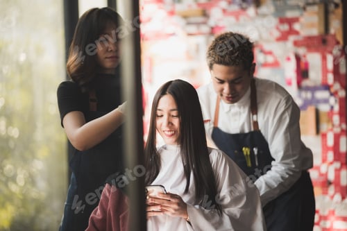 Preview: Asian long black straight hair female cutting her hair at luxery salon with professional dresser