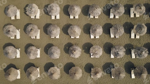 Preview: Aerial view of a sandy beach with umbrellas