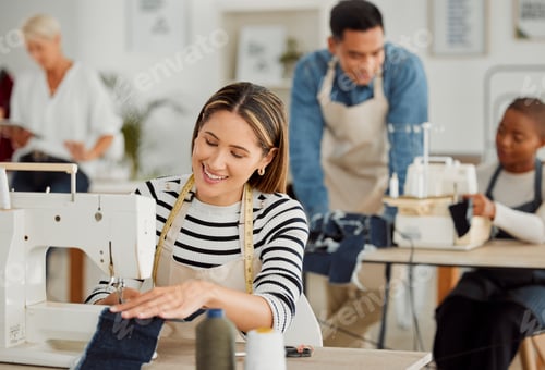 Preview: Happy and smiling female seamstress working on design in textile factory and sewing fabric. A joyfu