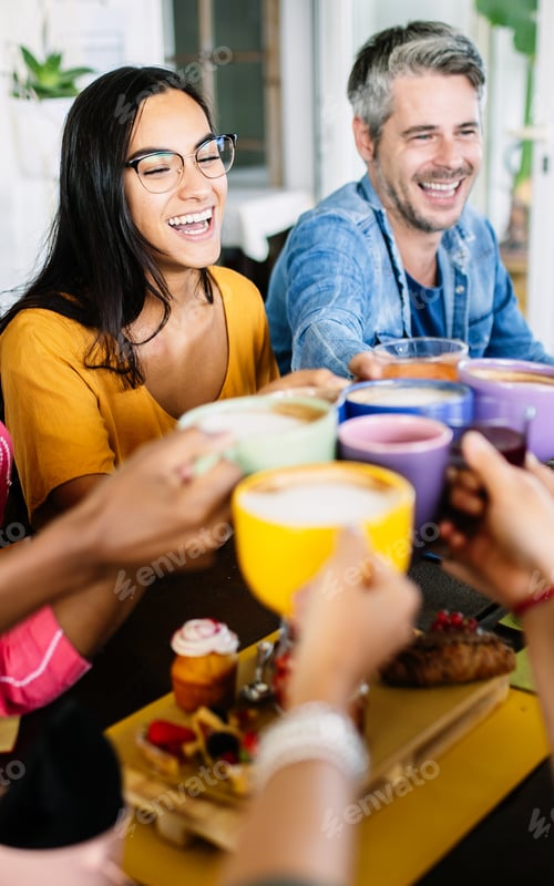 Preview: Group of young people having breakfast toasting coffee at rooftop bar terrace