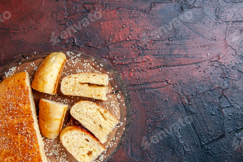 Preview: top view delicious sweet pastry sliced in pieces on the dark background cake dough pie