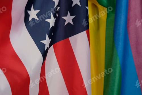 Preview: closeup of a gay pride flag and a flag of the United States of America