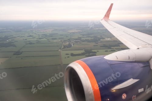 Preview: Airplane flight. Wing of an airplane flying above the clouds.