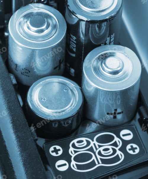 Preview: Loading Batteries Into A Electronic Device. Toned In Blue
