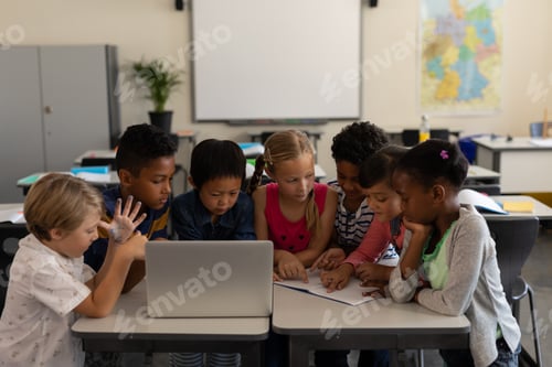 Preview: Group of school kids studying together in classroom
