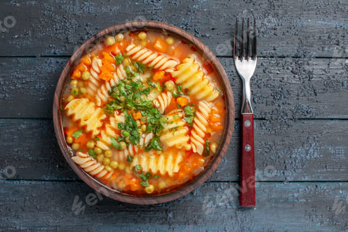 Preview: top view delicious pasta soup from spiral italian pasta with greens on dark desk dinner dish italian