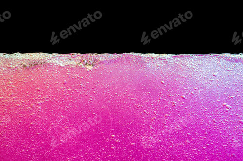 Preview: Pink bubbly boiling water against black background