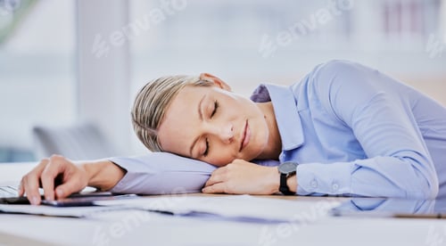 Preview: Tired young caucasian business woman sitting at desk and sleeping. Exhausted young female professio