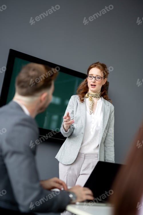 Preview: Group of lawyers discussing contract together in office
