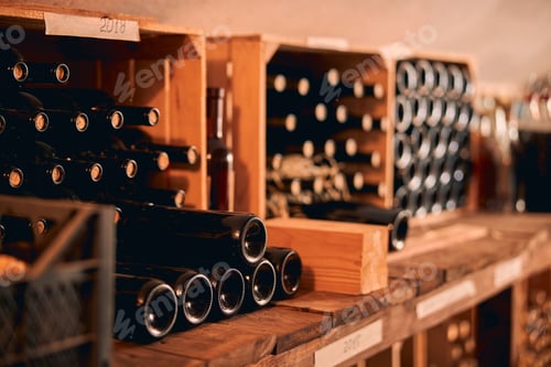 Preview: Glass bottles of wine in wooden crates