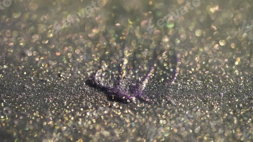 Preview: Close up view of purple and grey eye shadow with shimmer