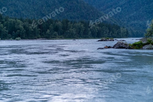 Preview: A wide, full-flowing mountain river with a fast current.