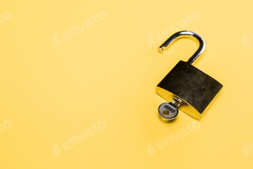 Preview: metallic locker with key isolated on yellow