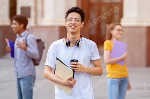 Preview: Asian guy standing outdoors with his friends