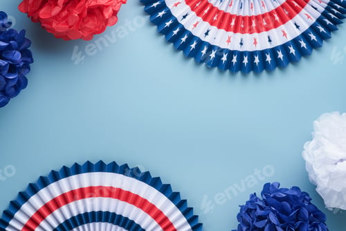 Preview: 4th of July background. USA paper fans, Red, blue, white stars and confetti on blue wall background.