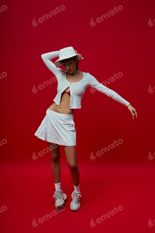 Preview: Graceful Woman in White Dress and Hat