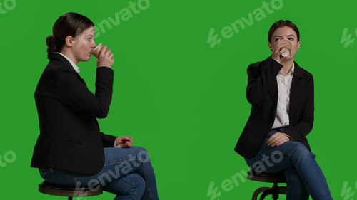 Preview: Close up of corporate employee serving coffee cup in studio