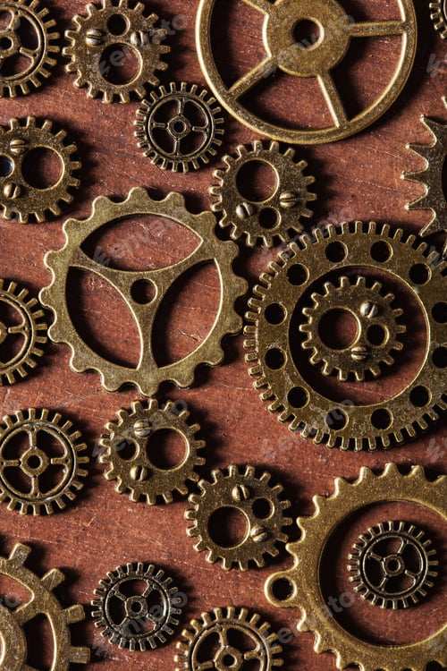 Preview: steampunk mechanical cogs gears wheels on wooden background