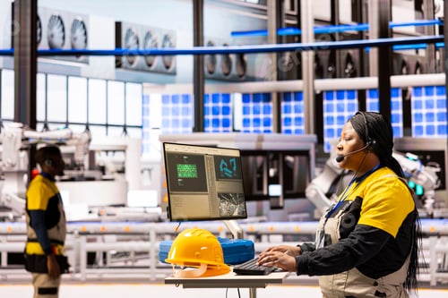 Preview: Professional technician optimizing smart manufacturing system