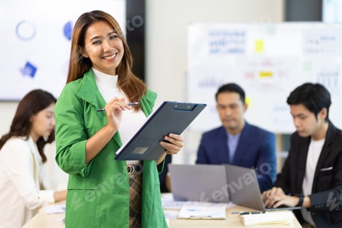 Preview: Portrait of a attractive business woman in a business office meeting room.