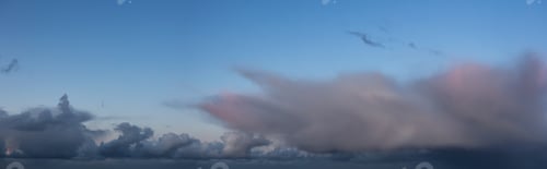 Preview: Dramatic Panoramic View of a cloudscape during a dark, rainy and colorful sunrise