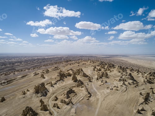 Preview: Aerial view of landscape in desert under blue sky