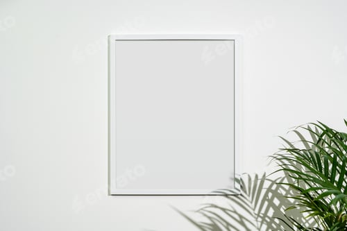 Preview: White wooden photo frame with plant leaves on white background