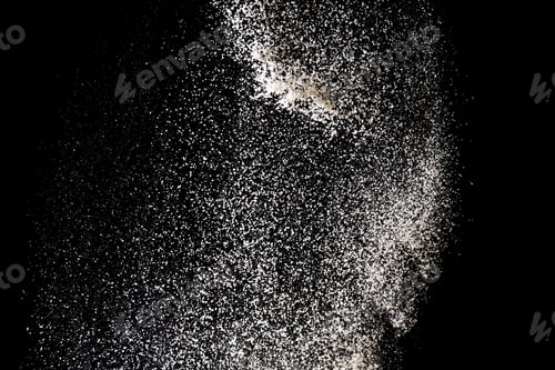 Preview: White powder splash isolated on black background. Flour sifting on a black background