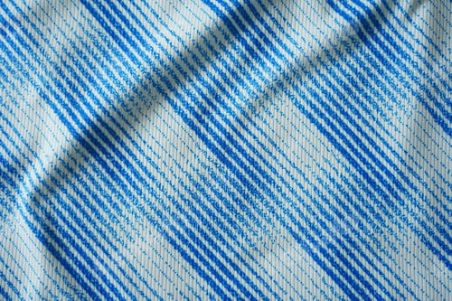 Preview: Close up of blue football jersey sports clothing fabric texture.