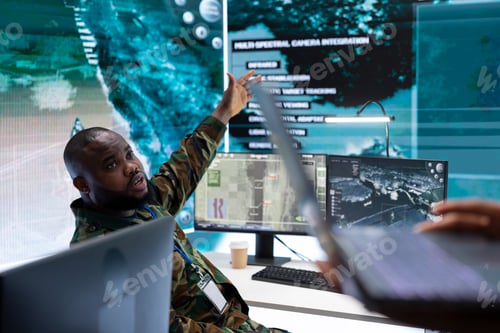 Preview: Army expert in a modern base of operations with satellite data
