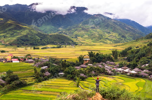 Preview: Traaveler take picture at Rice fields on terraced of Tu le District, YenBai province