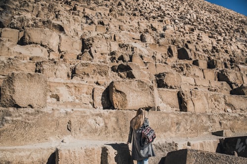 Preview: A European blonde walks near the pyramids in the desert in Cairo
