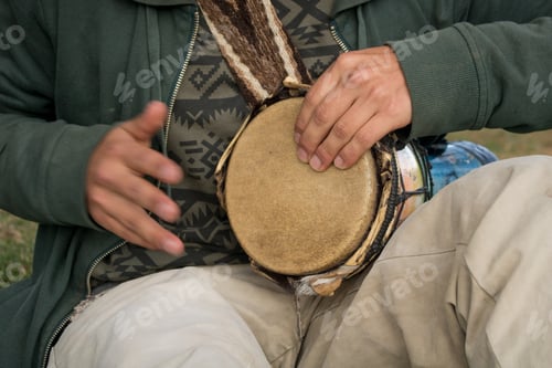 Preview: Closeup of a musician man playing the goblet drum musical instrument