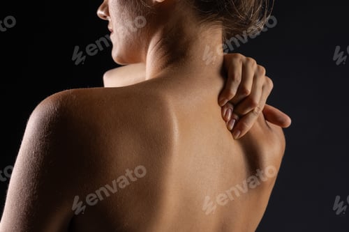 Preview: woman massaging neck close up, concept of neck pain with osteochondrosis protrusion and hernia