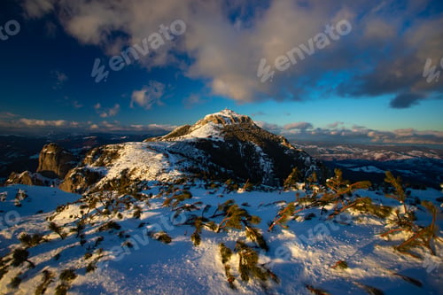 Preview: Hiker in a wintry mountain landscape