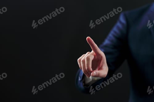 Preview: Businessman's hand pointing on black background