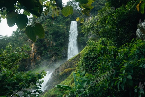 Preview: A beautiful waterfall cascades down from a rocky