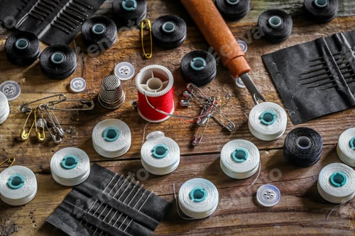 Preview: set of sewing threads and accessories on wooden background